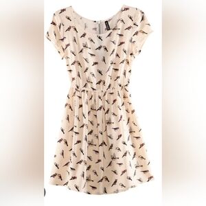 short sleeve dress light beige/khaki color with a black bird print. Size Medium